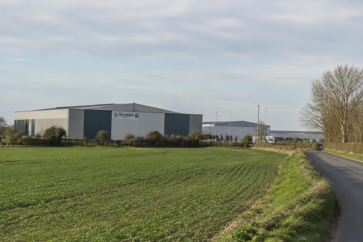 Bicester logistics units beside open farmland and a country lane